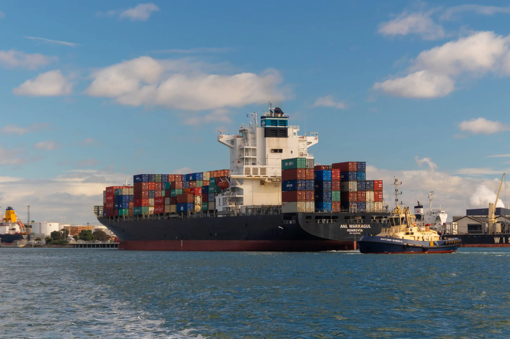 Cargo ship in port at dusk